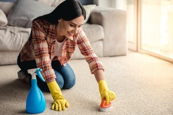 woman cleaning carpet